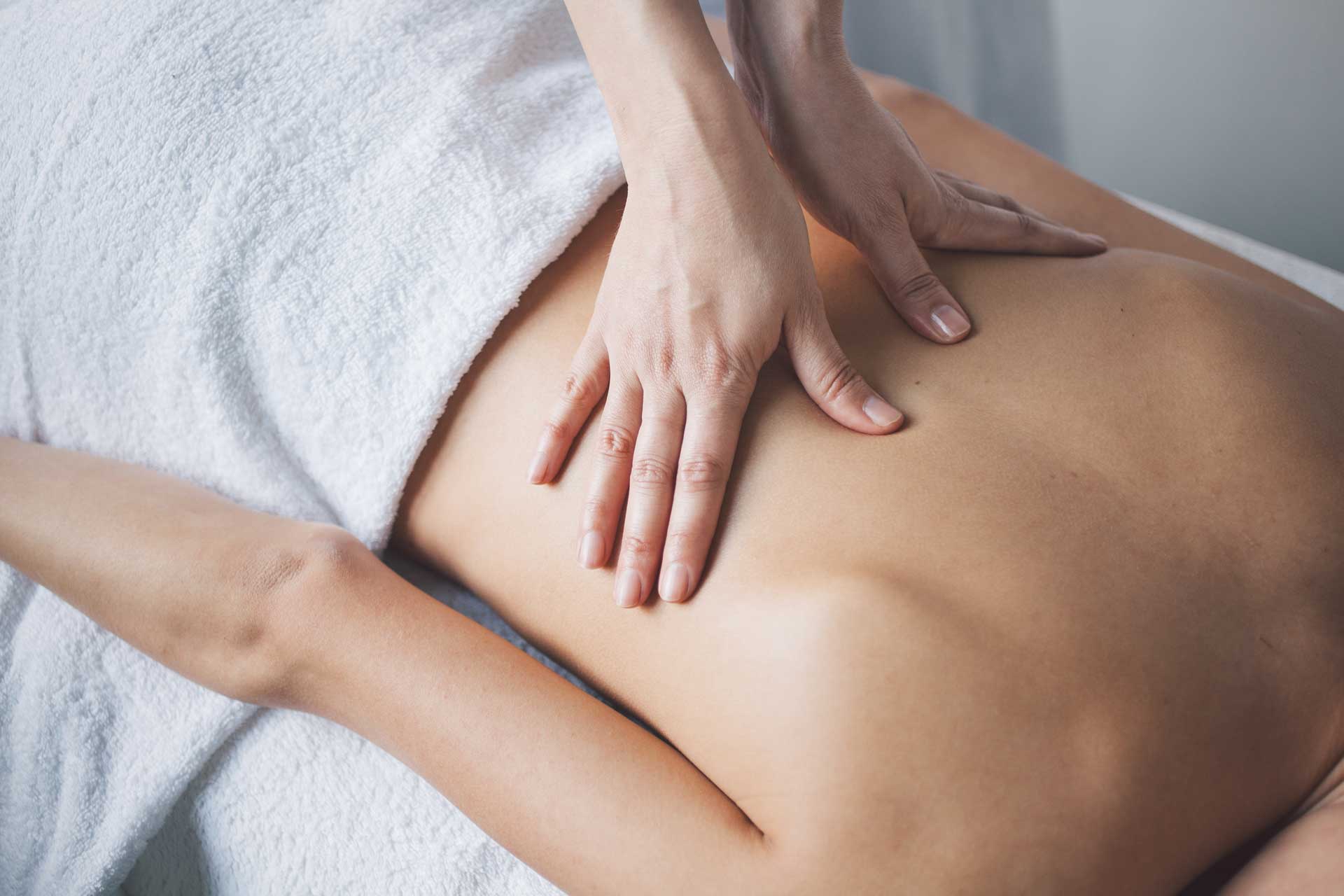 a woman receiving a back massage